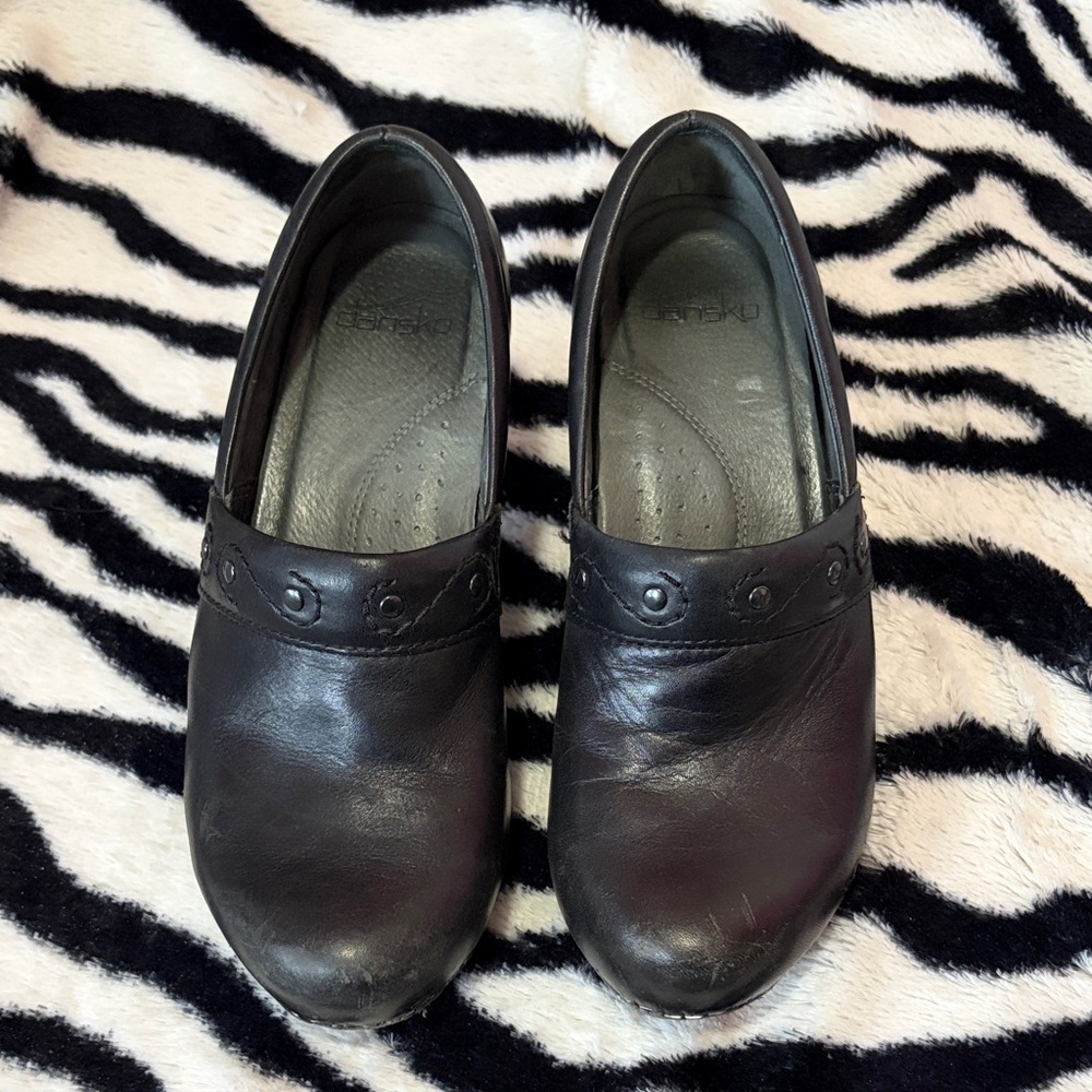 Dansko Black Leather Slip-On Clogs with Stud Accent